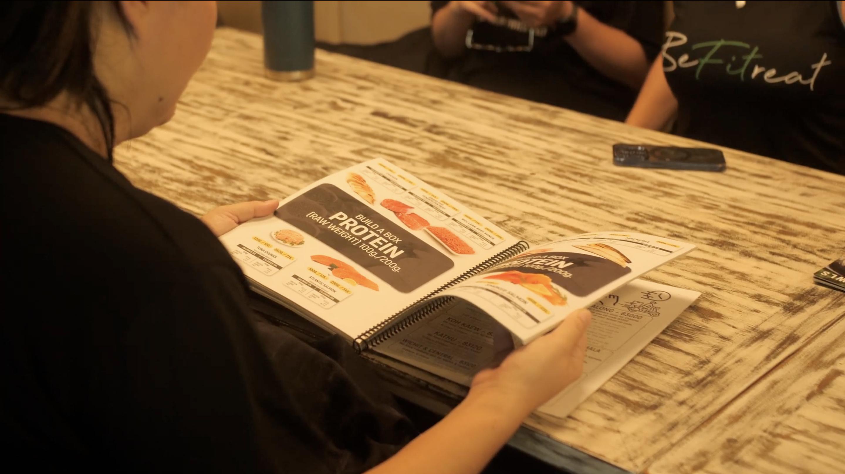 Female flicking through a menu