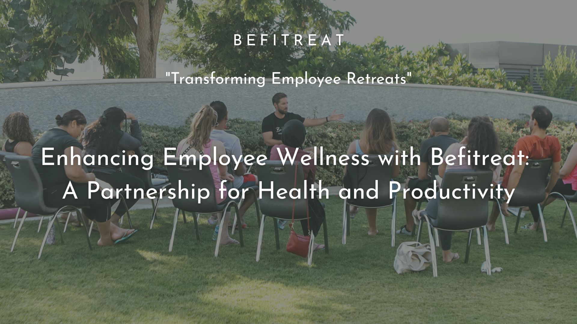 Coworkers on a BeFitreat corporate wellness retreat sitting listening to a workshop